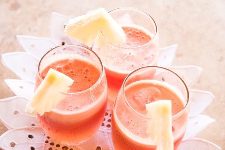 smoothies in glass with pineapple slices