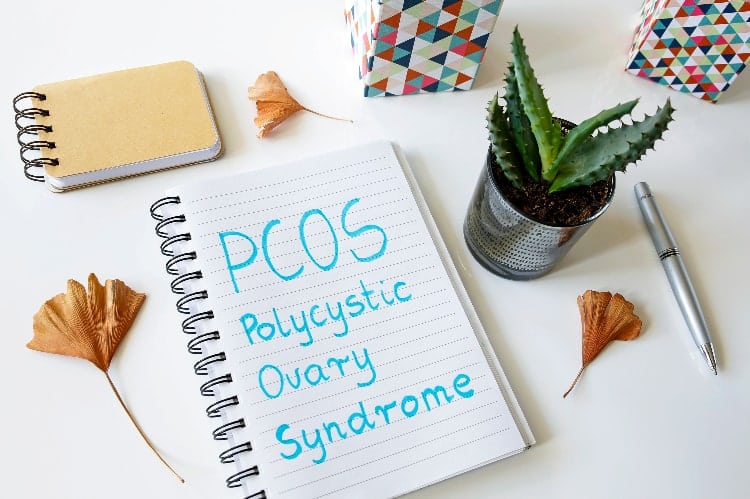 notebook with polycystic ovary syndrome written down