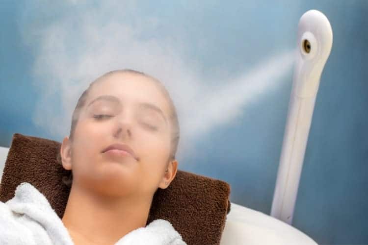 is it bad to steam your face - image showing woman getting spa steaming