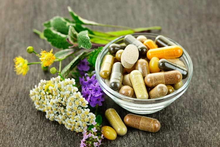 bowl containing supplements for female hormonal imbalance