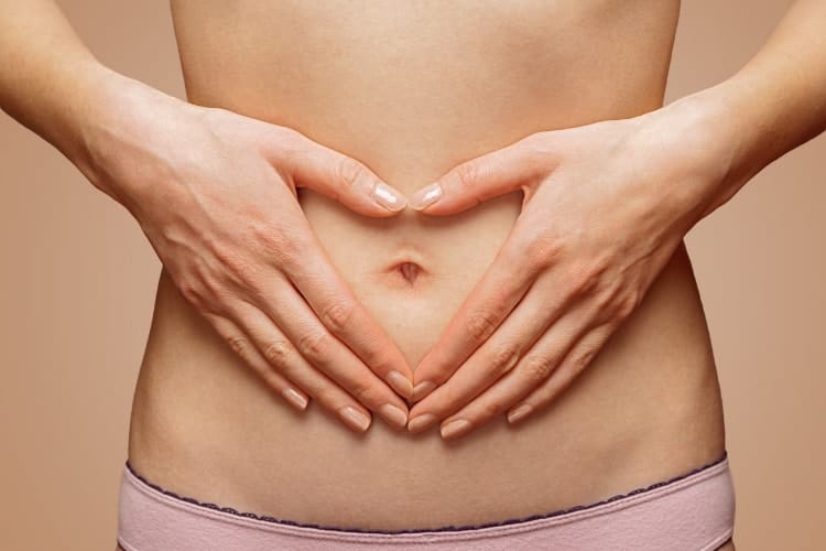where do you apply clary sage oil - image showing woman's belly