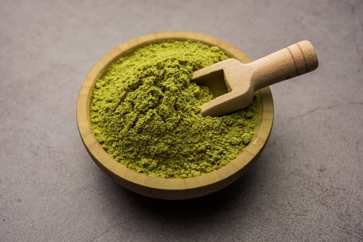 best tea rinses for hair growth - henna powder in a bowl