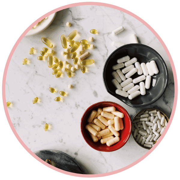 supplement pills in bowls and flat surface