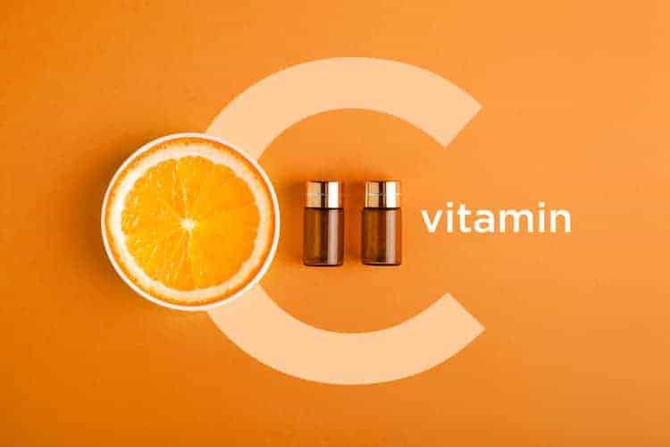 bottles of vitamin c serum with orange 