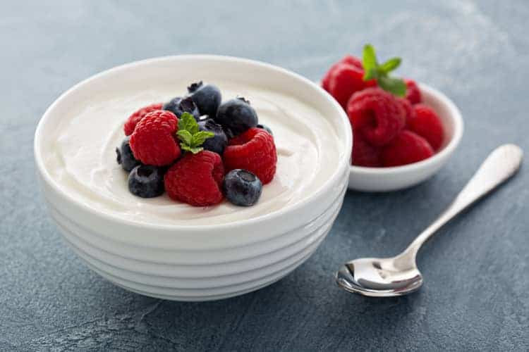 bowl of yogurt with fresh berries on top