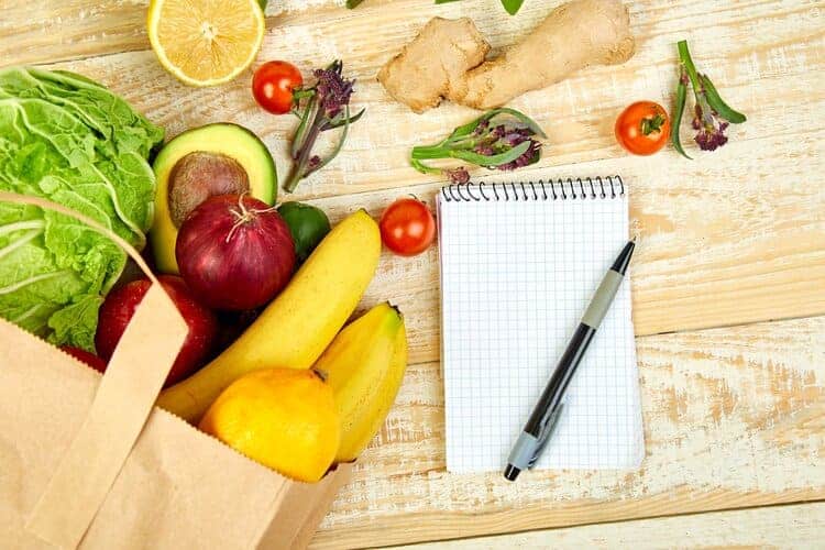 fresh produce and grocery list notepad