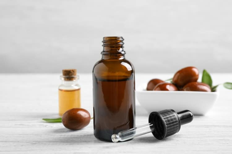 bottle of jojoba oil with dropper