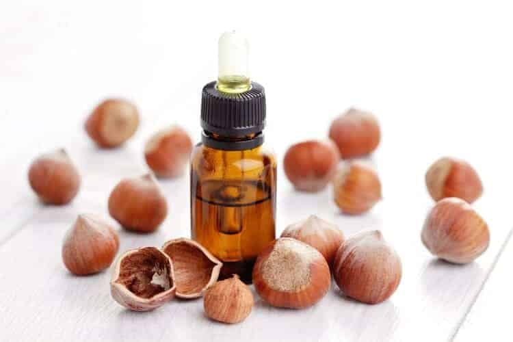 hazelnuts and bottle of oil