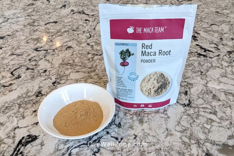 red maca powder in a bowl and bag