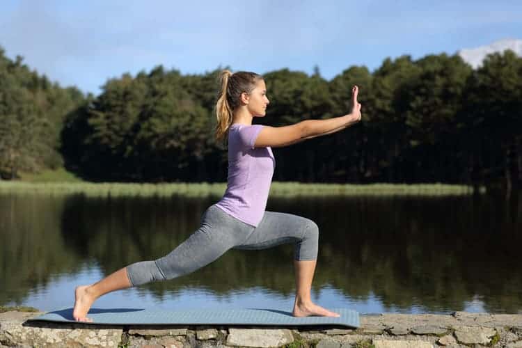 woman practicing meditative movement outdoors