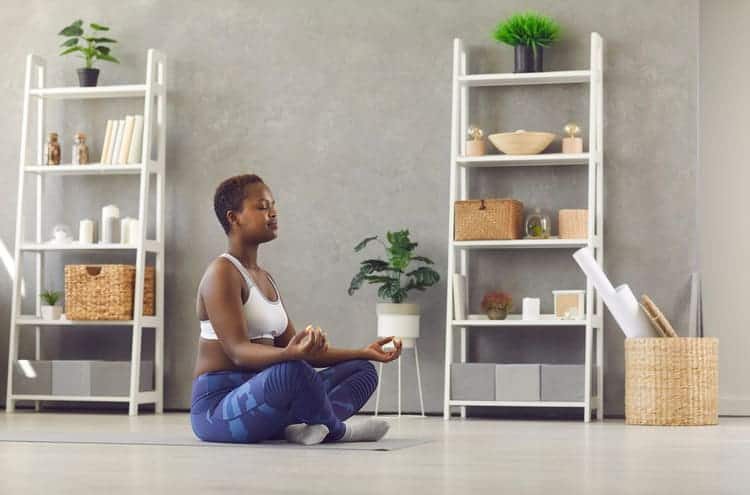 woman meditating in cross legged position